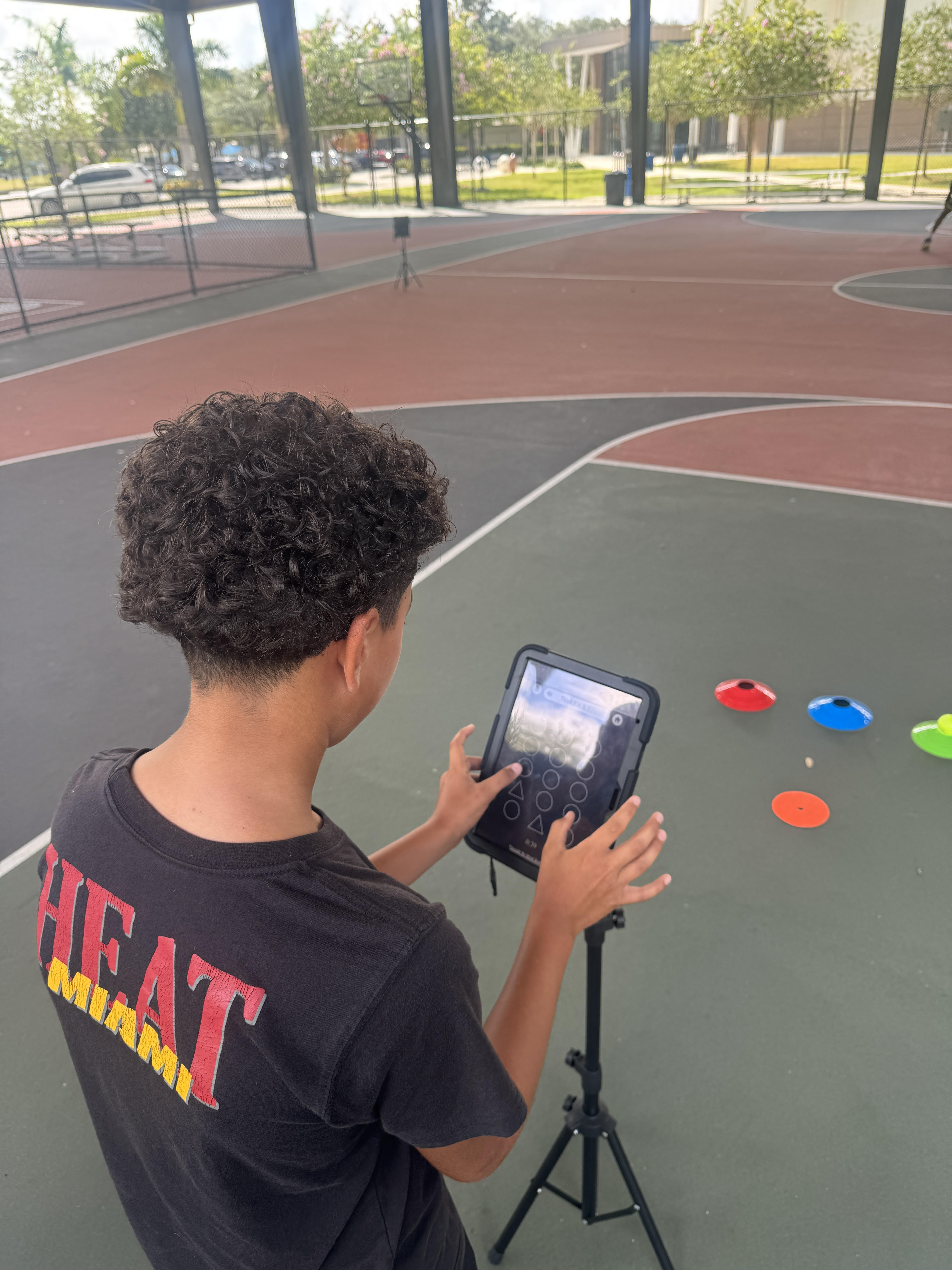 USA athlete using tablet on basketball court